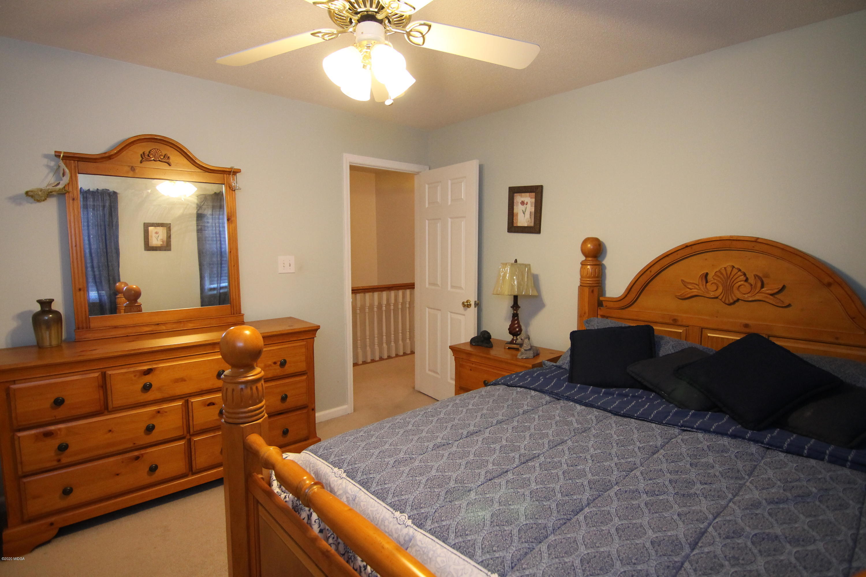 226 Ruben Road Byron, GA 31008 - Photo 29 of 30 a bedroom with a bed and a dresser
