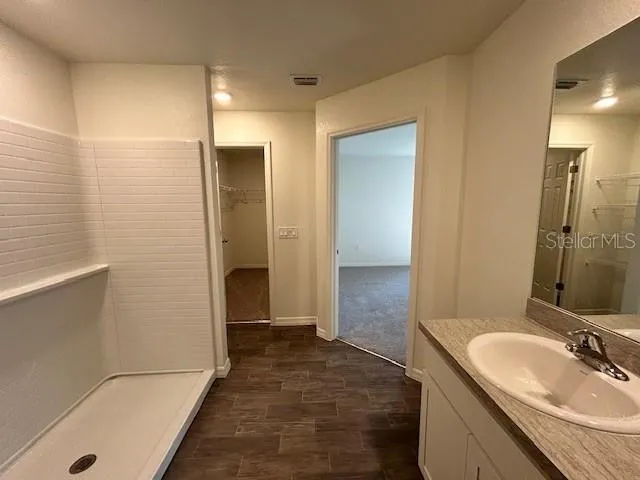 a bathroom with a sink and a mirror