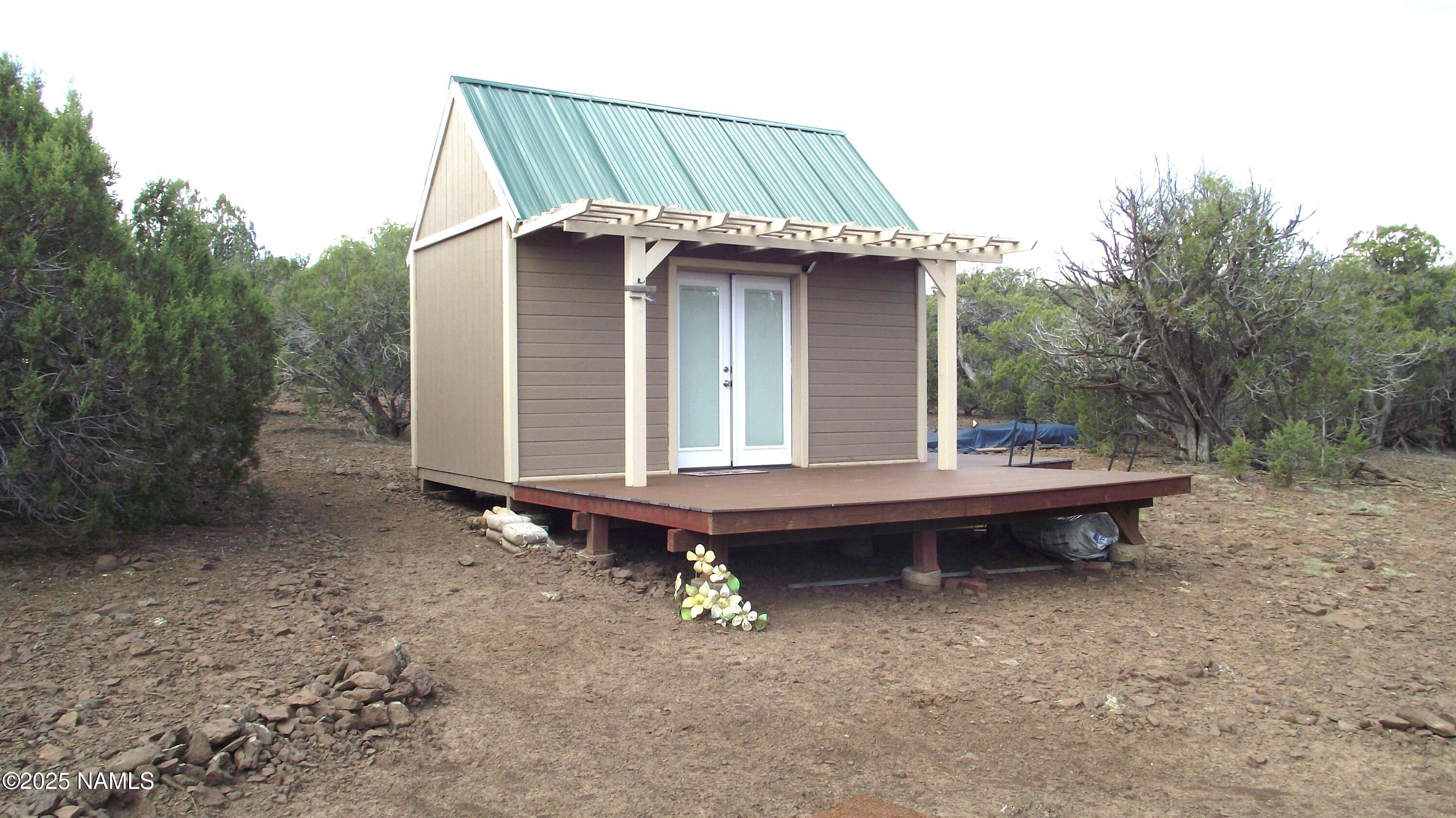 13 Westwood Ranch Road Williams, AZ 86046 - Photo 4 of 31 a backyard of a house with outdoor seating area