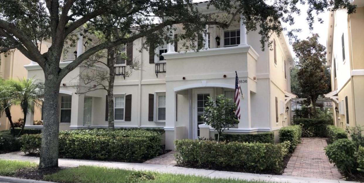 front view of a house with a garden