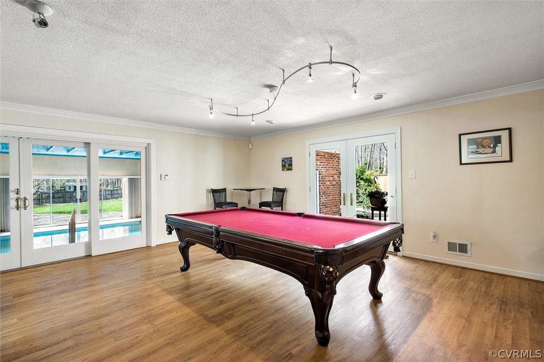 2800 Queenswood Road Midlothian, VA 23113 - Photo 24 of 45 a living room with a pool table and wooden floor