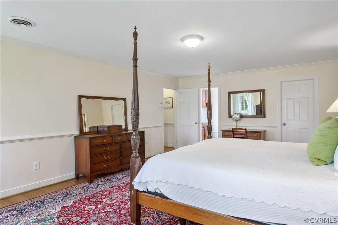 2800 Queenswood Road Midlothian, VA 23113 - Photo 29 of 45 a bedroom with a bed and wooden floor