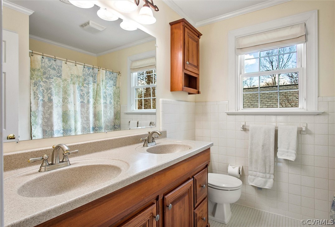 2800 Queenswood Road Midlothian, VA 23113 - Photo 30 of 45 a bathroom with a granite countertop sink a toilet and a mirror