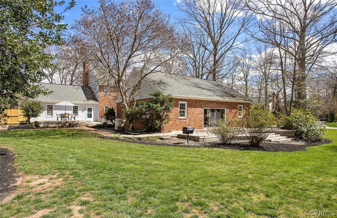 2800 Queenswood Road Midlothian, VA 23113 - Photo 42 of 45 a front view of a house with garden and trees