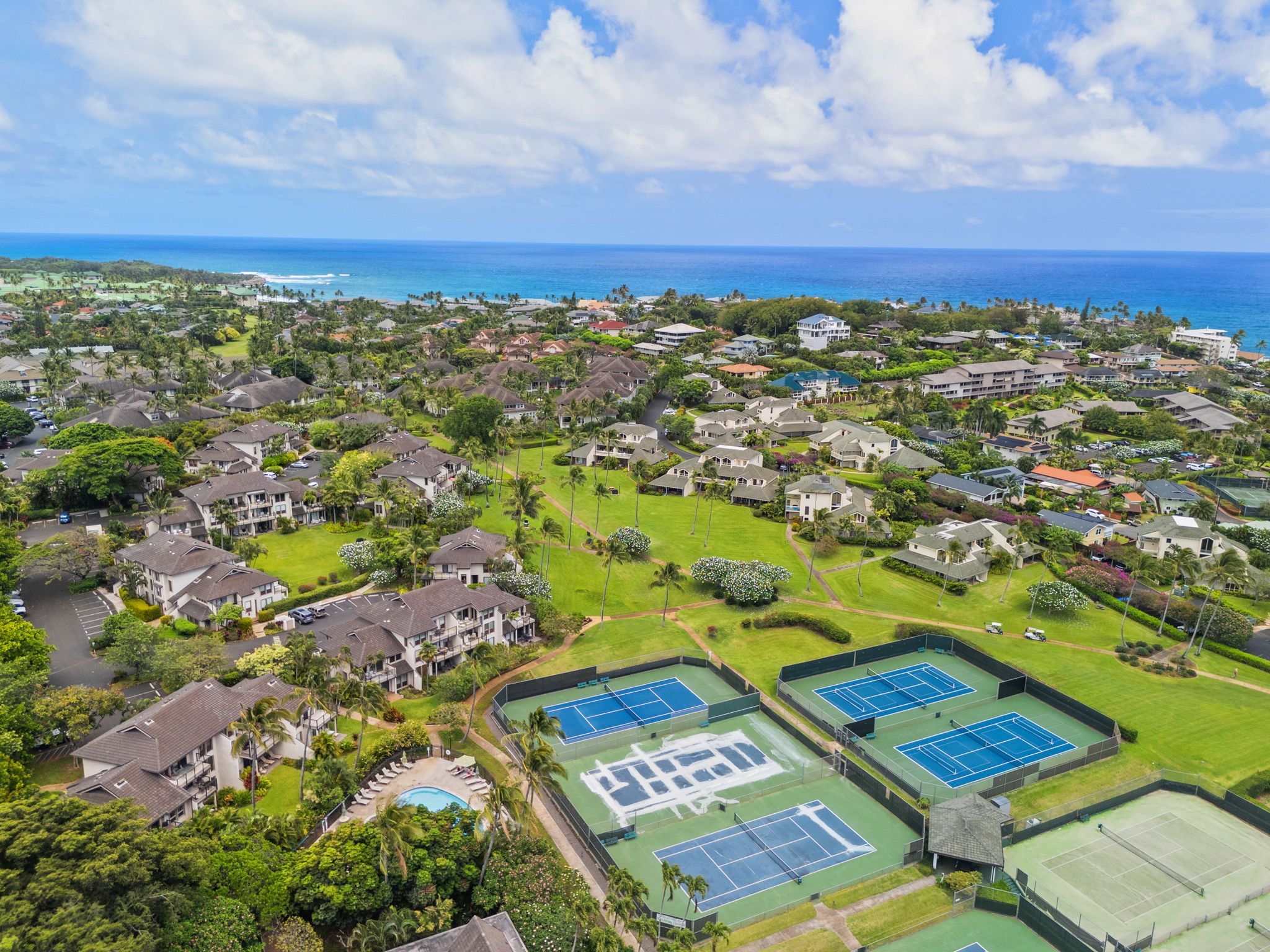 an aerial view of residential houses with outdoor space