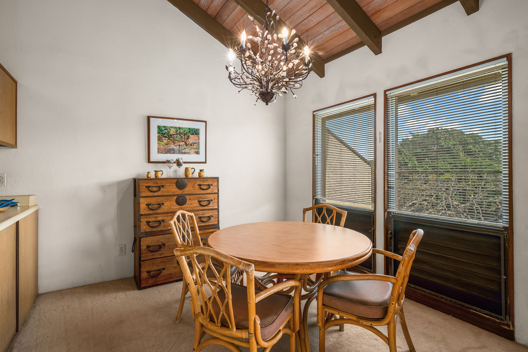1901 Poipu Road, Unit 832 Koloa, HI 96756 - Photo 12 of 19 a view of a dining room with furniture and a chandelier