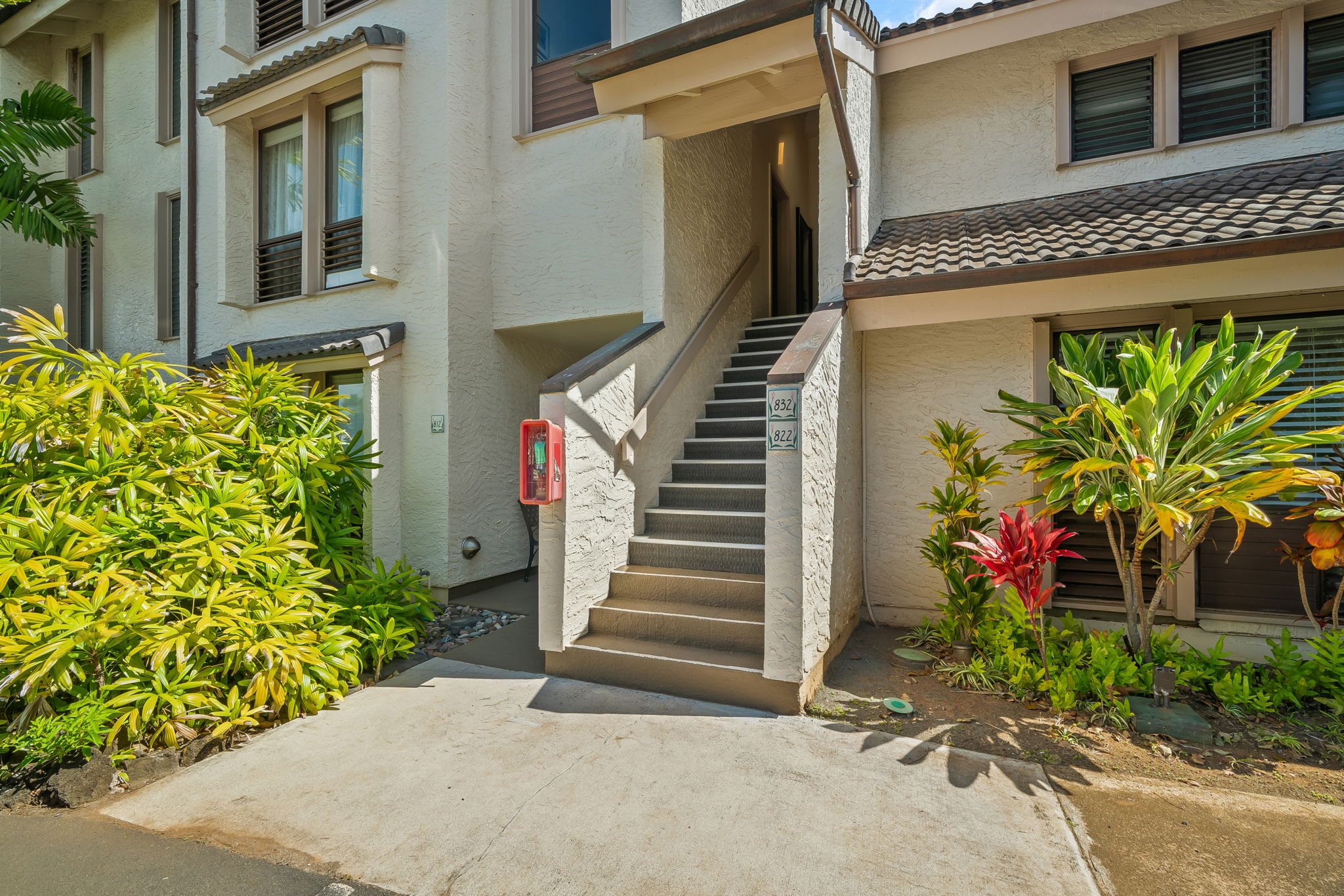1901 Poipu Road, Unit 832 Koloa, HI 96756 - Photo 13 of 19 a view of a entryway door with flower plants