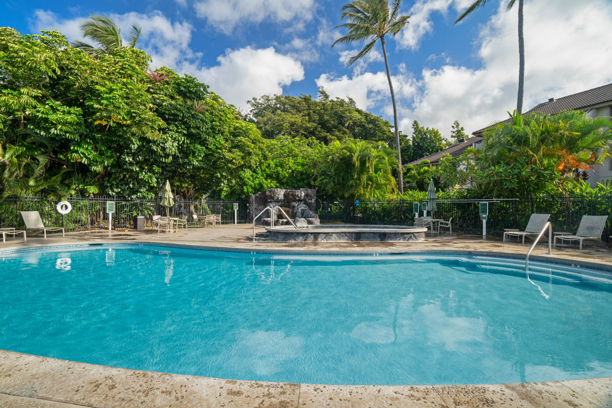 1901 Poipu Road, Unit 832 Koloa, HI 96756 - Photo 16 of 19 a swimming pool with outdoor seating and yard