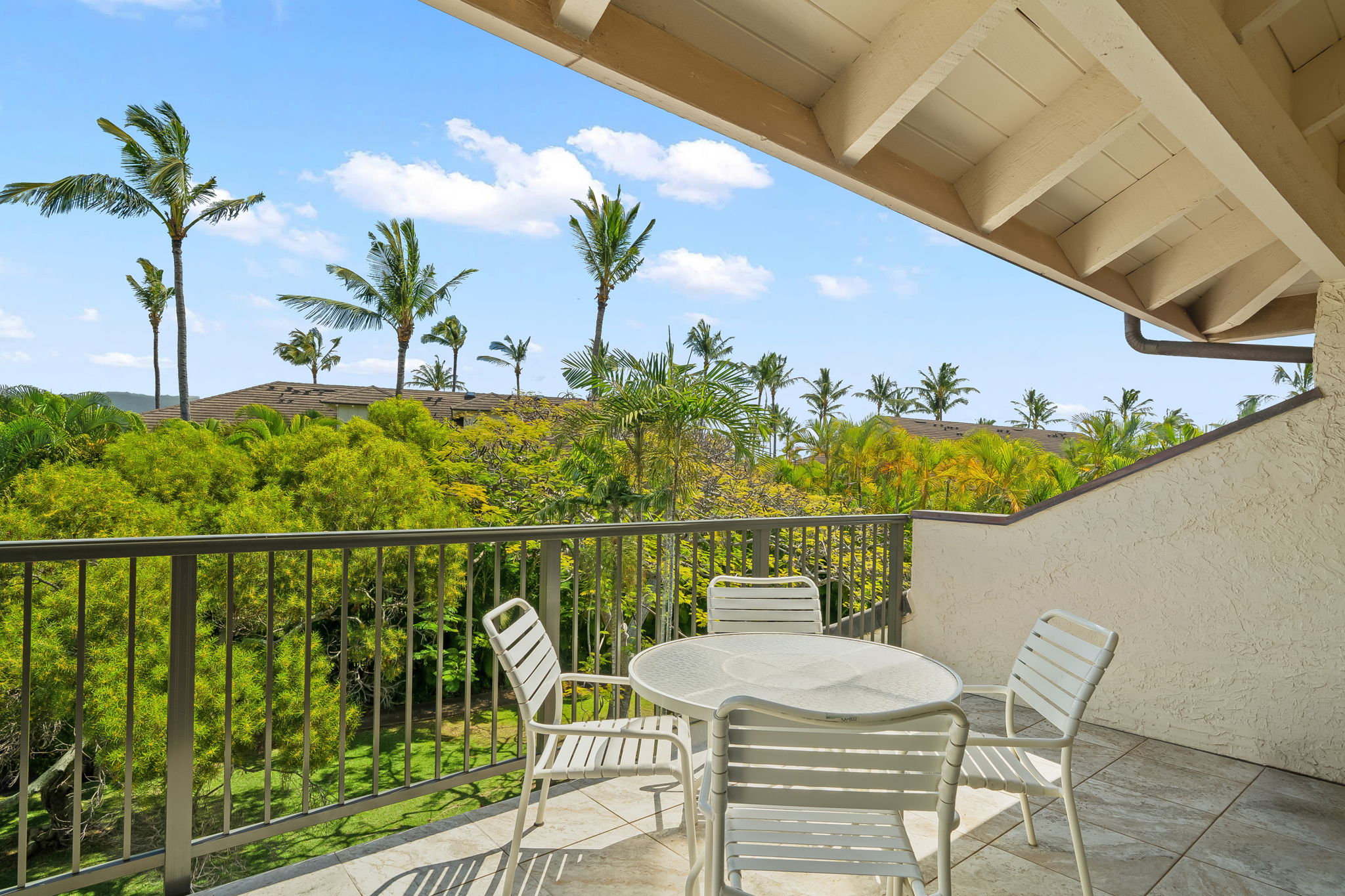 1901 Poipu Road, Unit 832 Koloa, HI 96756 - Photo 2 of 19 a view of a balcony with chair and table