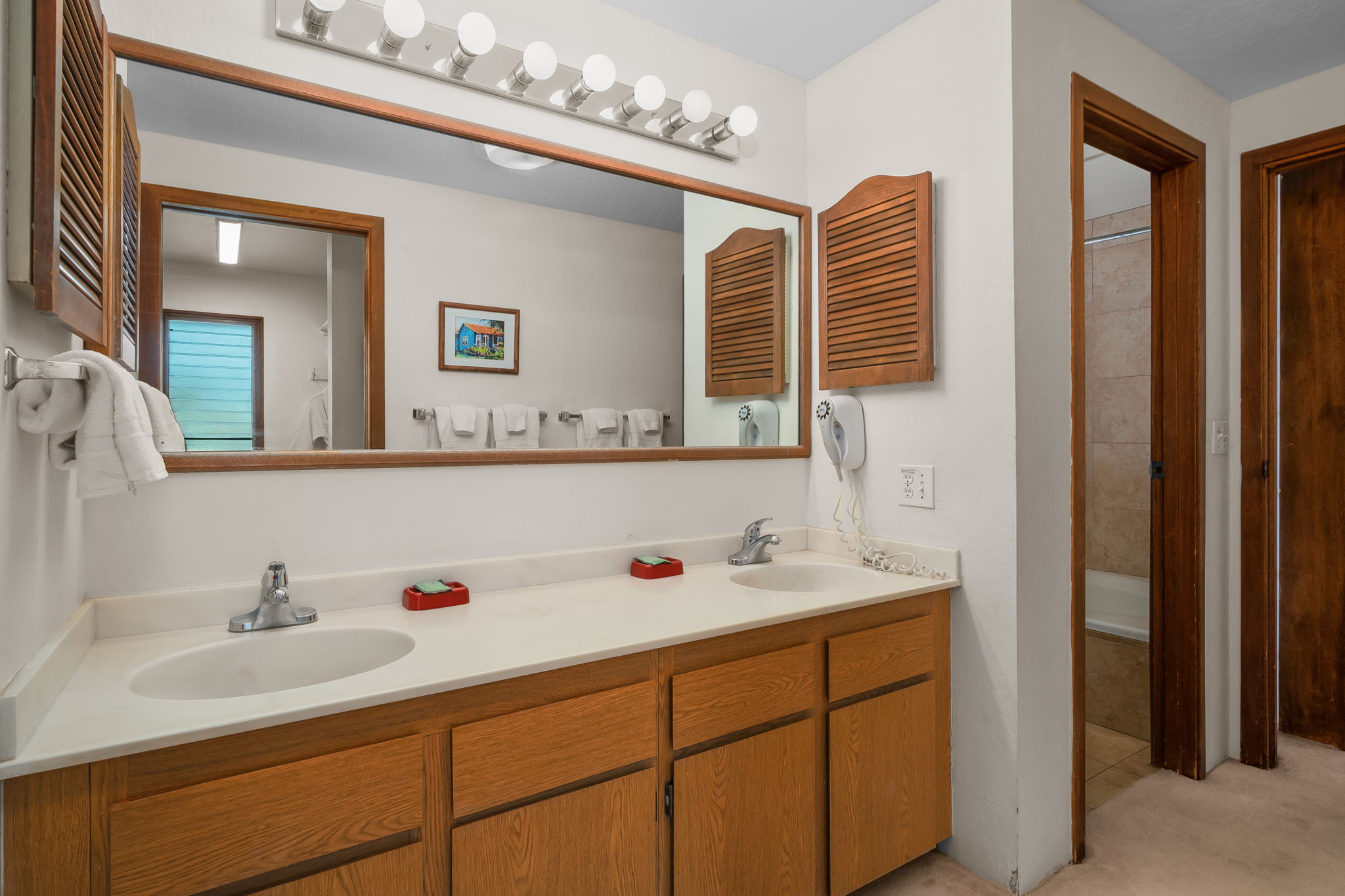 1901 Poipu Road, Unit 832 Koloa, HI 96756 - Photo 9 of 19 a bathroom with a sink double vanity and a mirror
