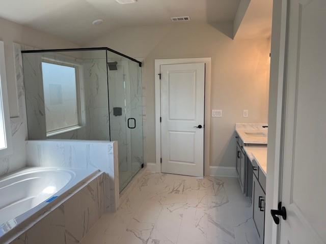 4265 Trinity Oaks Trail Cumming, GA 30040 - Photo 13 of 25 a bathroom with a bathtub and a shower
