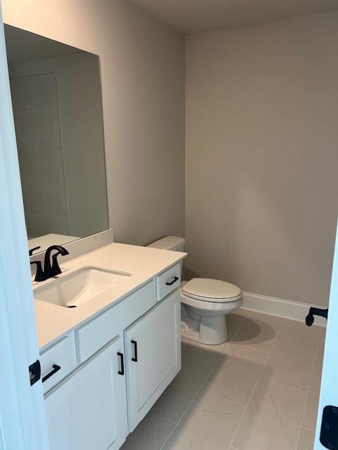 4265 Trinity Oaks Trail Cumming, GA 30040 - Photo 18 of 25 a bathroom with a granite countertop toilet and a sink