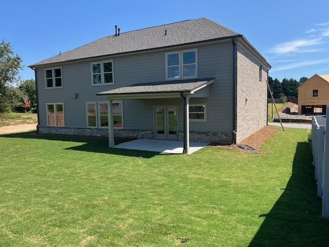 4265 Trinity Oaks Trail Cumming, GA 30040 - Photo 2 of 25 a view of a house with backyard and porch