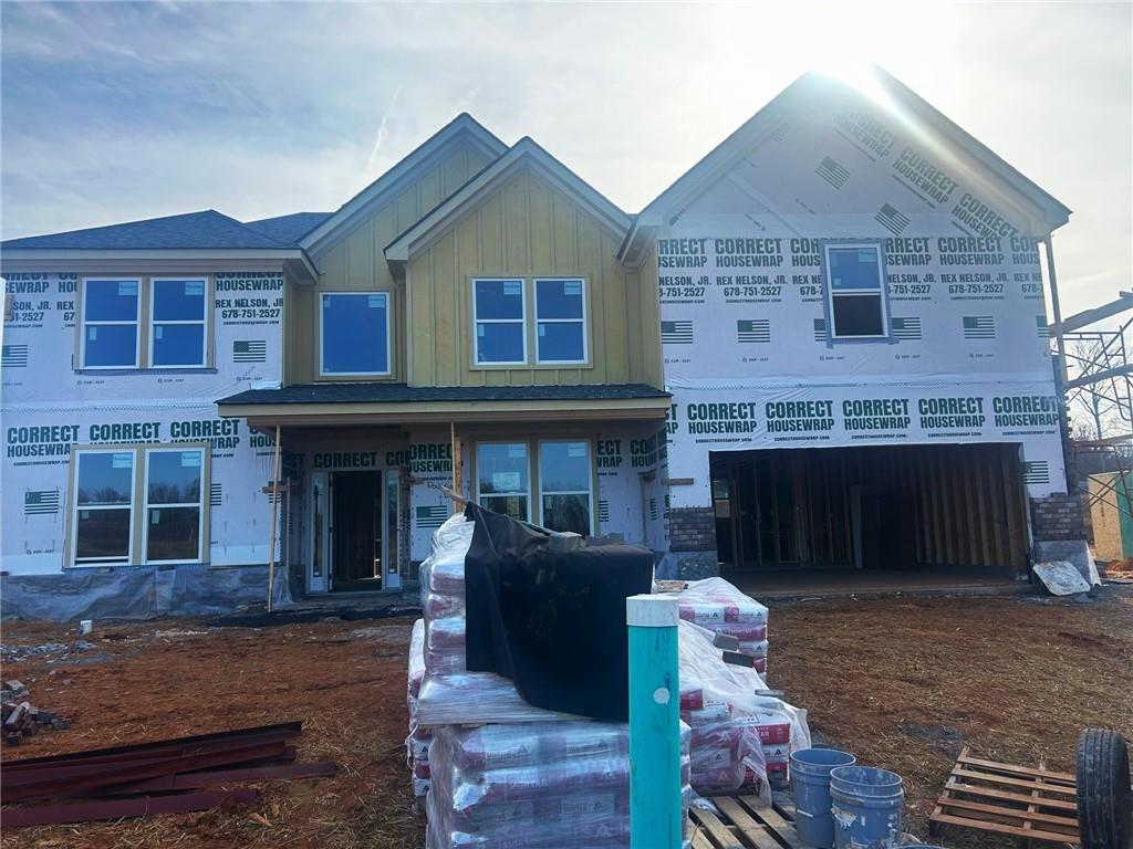 4265 Trinity Oaks Trail Cumming, GA 30040 - Photo 3 of 25 a front view of a house with a yard