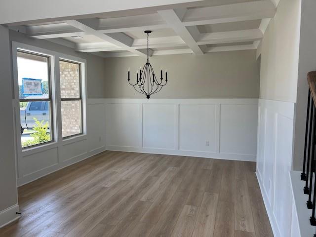 4265 Trinity Oaks Trail Cumming, GA 30040 - Photo 4 of 25 a view of a hallway with wooden floors and a window