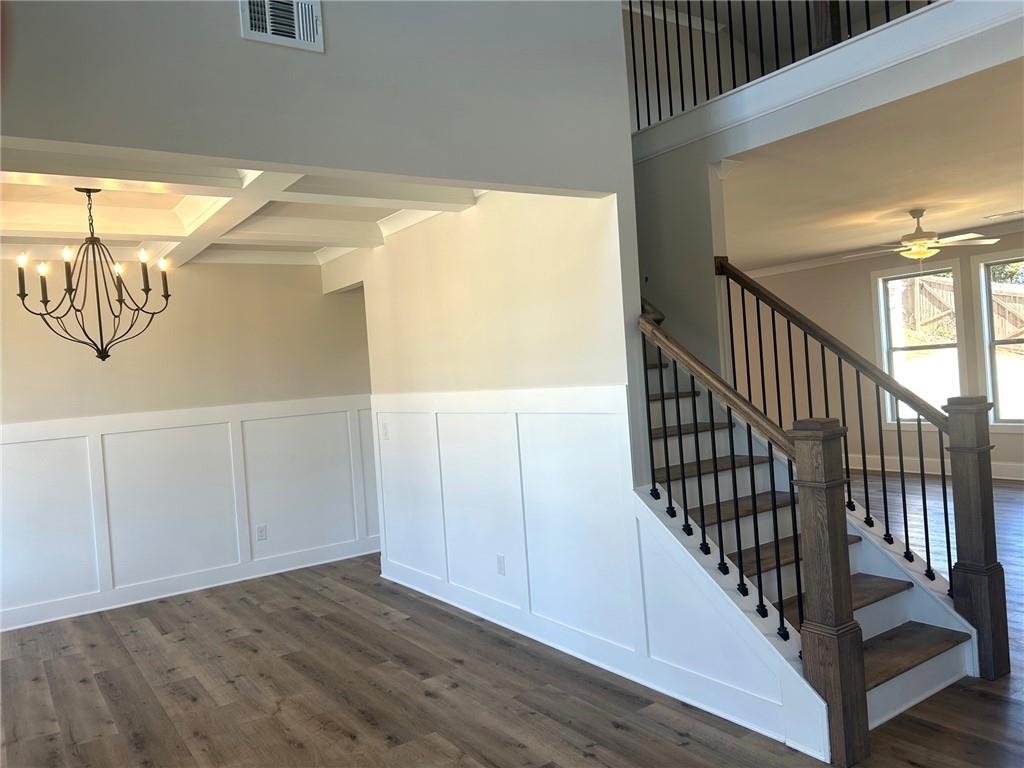 4265 Trinity Oaks Trail Cumming, GA 30040 - Photo 5 of 25 a view of staircase with wooden floor