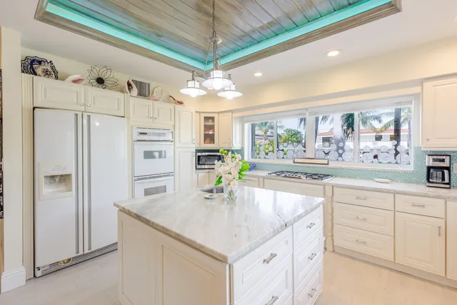 a living room with furniture and a garden