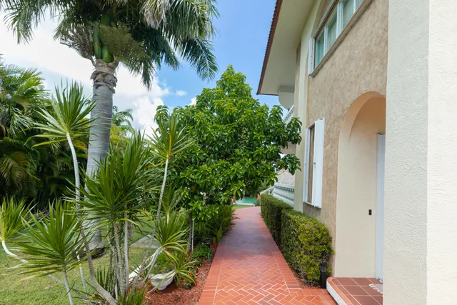 a kitchen with stainless steel appliances granite countertop a white cabinets and a stove top oven