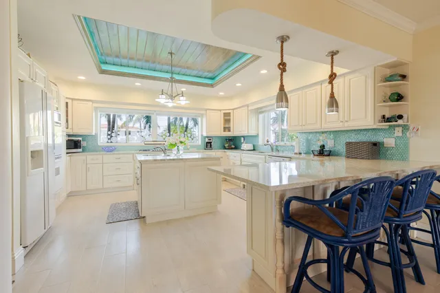 a bathroom with a sink mirror and vanity