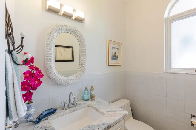 a balcony with furniture and a yard