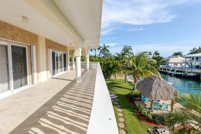a bedroom with a bed dresser and a window
