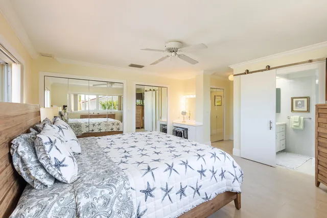 a bathroom with a double vanity sink mirror and bathtub