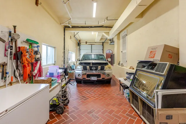 a view of a backyard and swimming pool