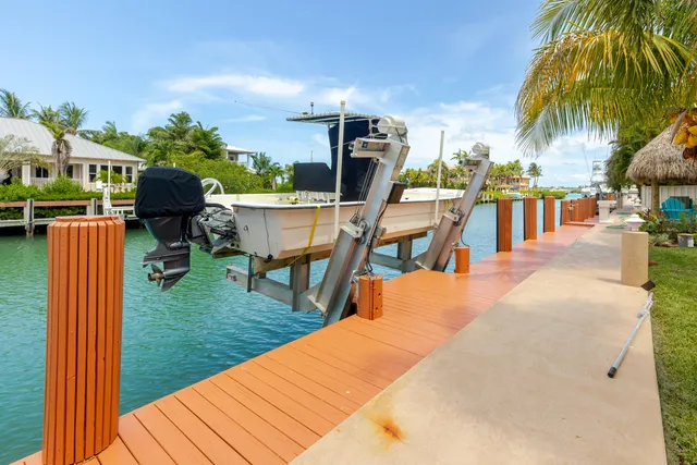 a view of a swimming pool with a yard and trees