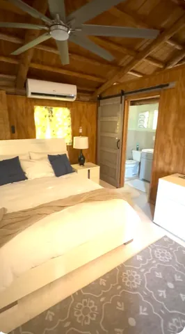 a view of a house with yard and deck