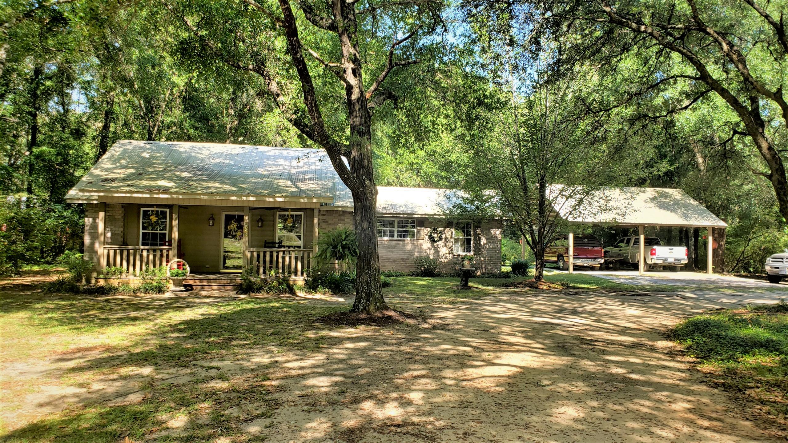 564 Harbuck Road DeFuniak Springs, FL 32433 - Photo 2 of 19 a front view of a house with a yard