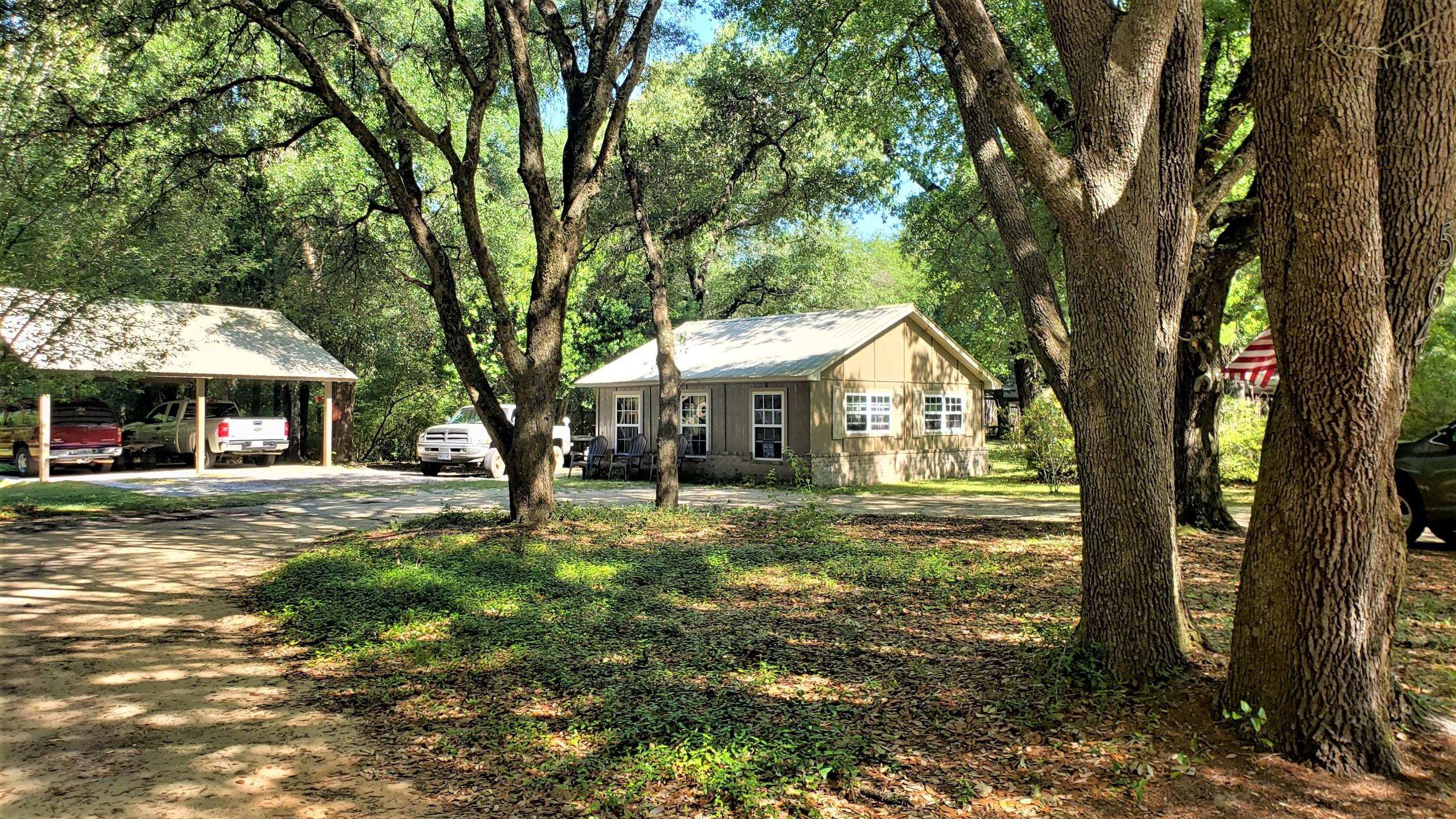 564 Harbuck Road DeFuniak Springs, FL 32433 - Photo 12 of 19 a front view of a house with garden