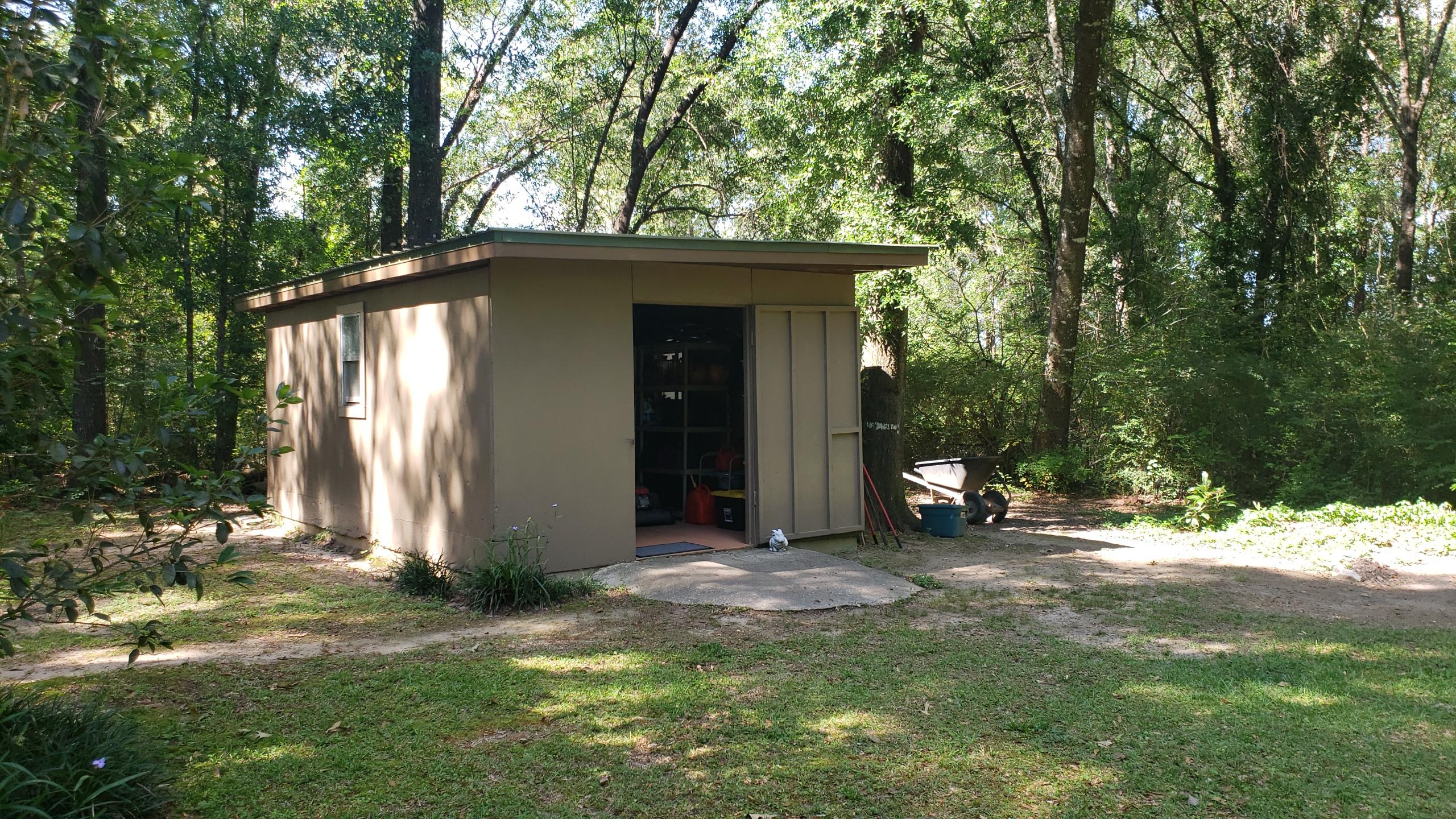 564 Harbuck Road DeFuniak Springs, FL 32433 - Photo 16 of 19 a view of a house with backyard and sitting area