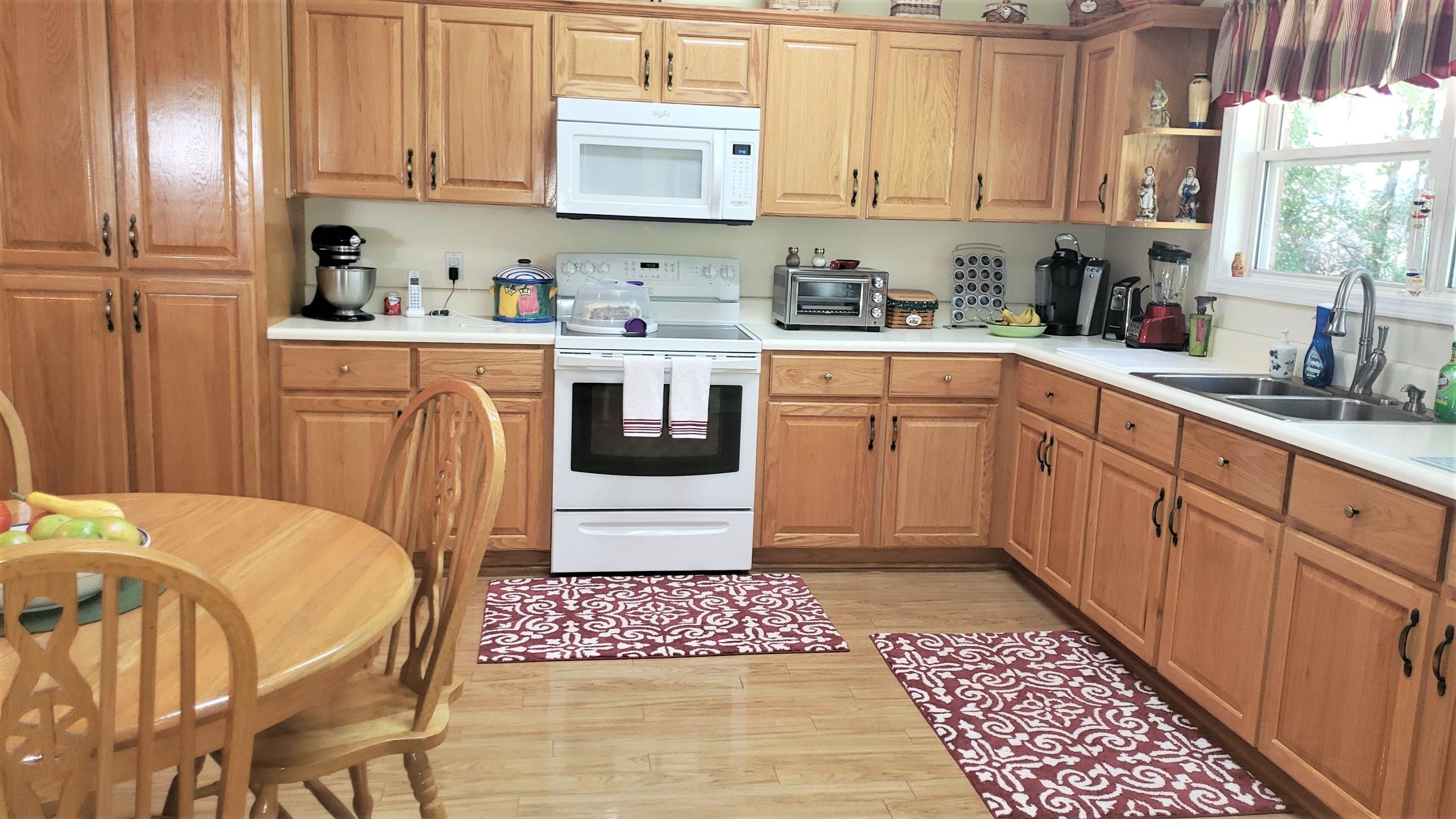 564 Harbuck Road DeFuniak Springs, FL 32433 - Photo 4 of 19 a kitchen with a sink cabinets and window