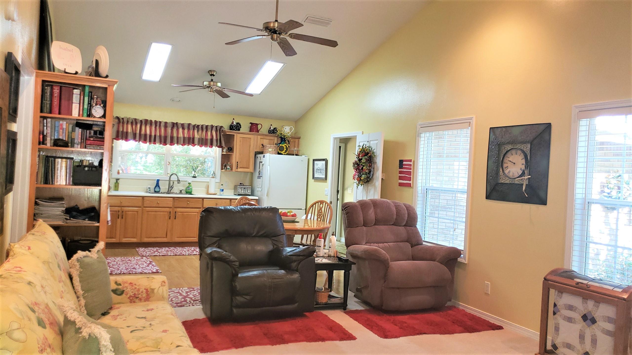 564 Harbuck Road DeFuniak Springs, FL 32433 - Photo 5 of 19 a living room with furniture wooden floor and a window