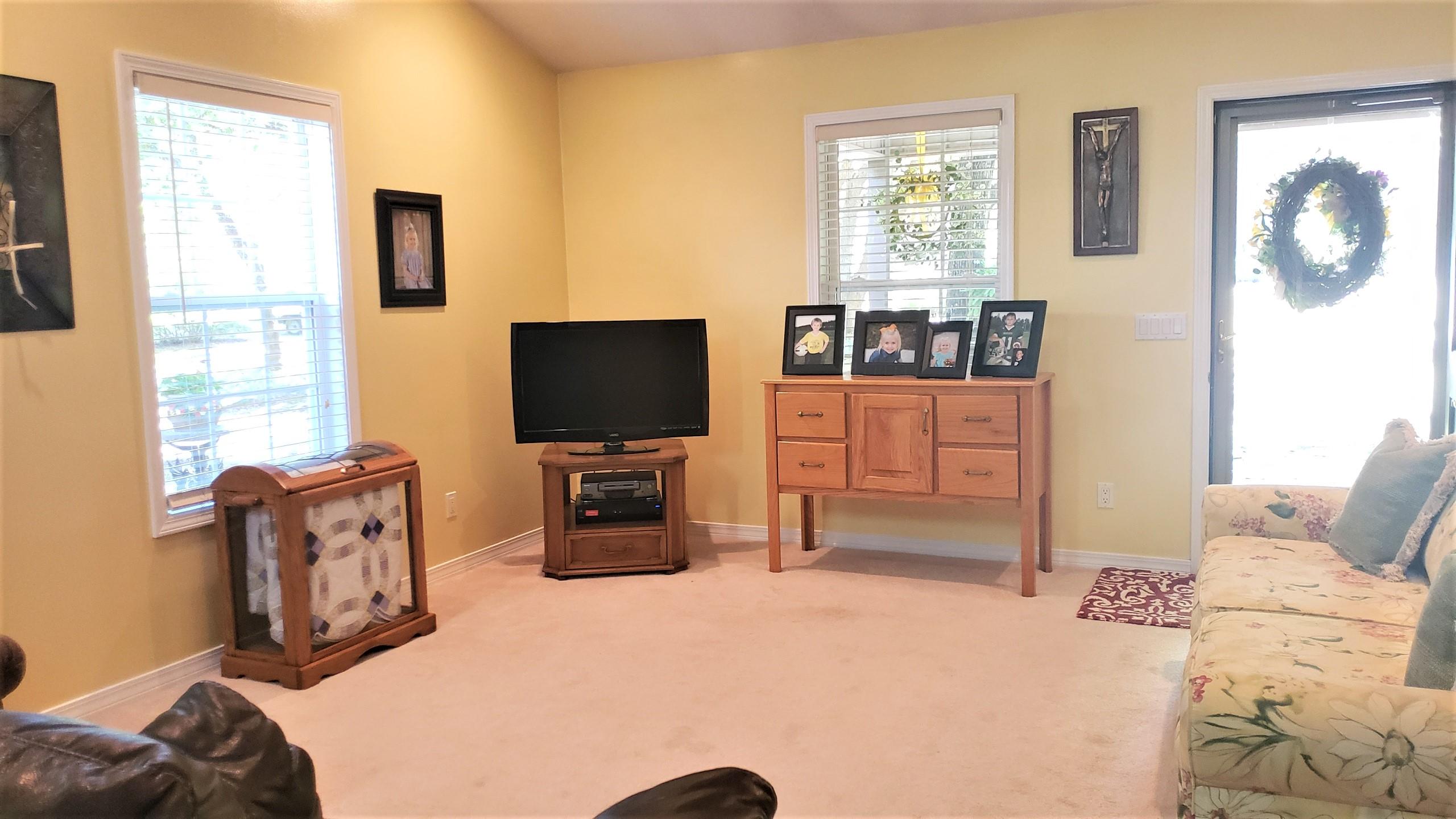 564 Harbuck Road DeFuniak Springs, FL 32433 - Photo 6 of 19 a bedroom with furniture and flat screen tv