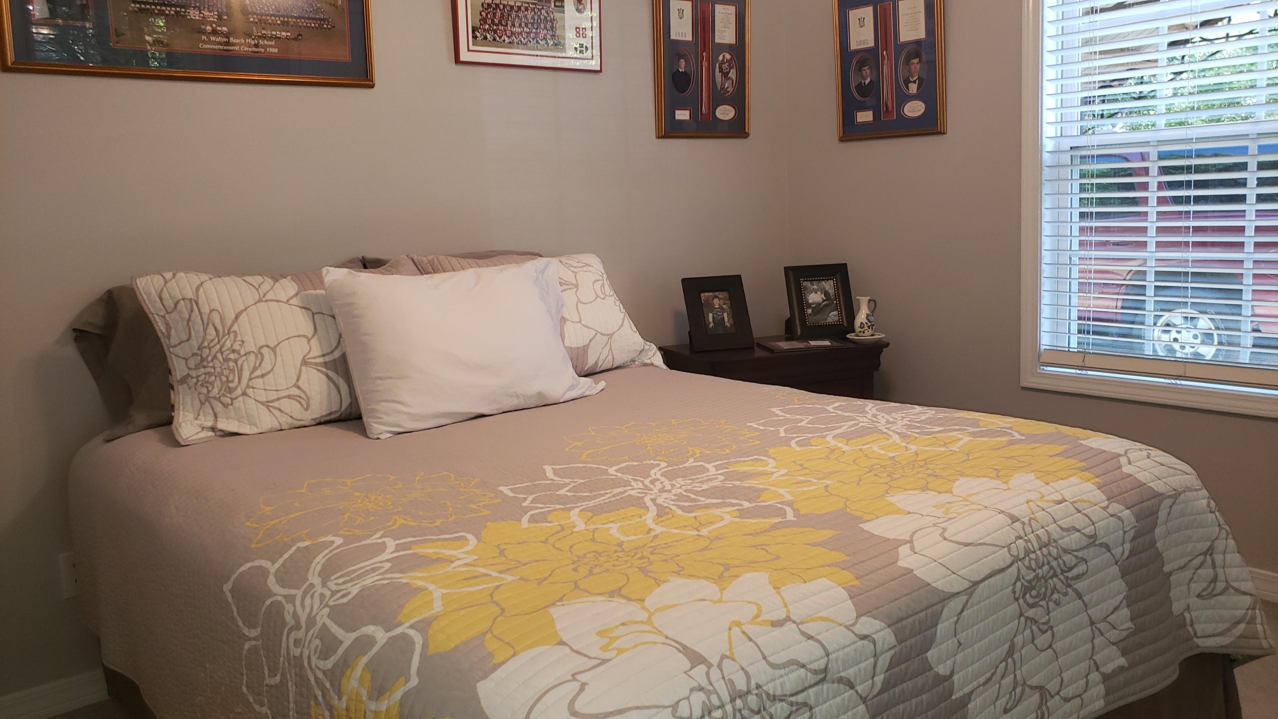 564 Harbuck Road DeFuniak Springs, FL 32433 - Photo 9 of 19 a large bed in a bedroom next to a window