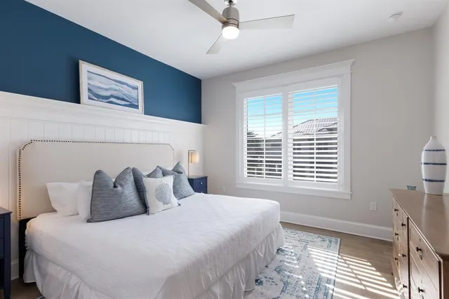 a bedroom with a bed and a night stand