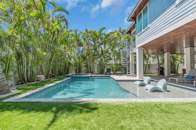 an aerial view of a house with a garden