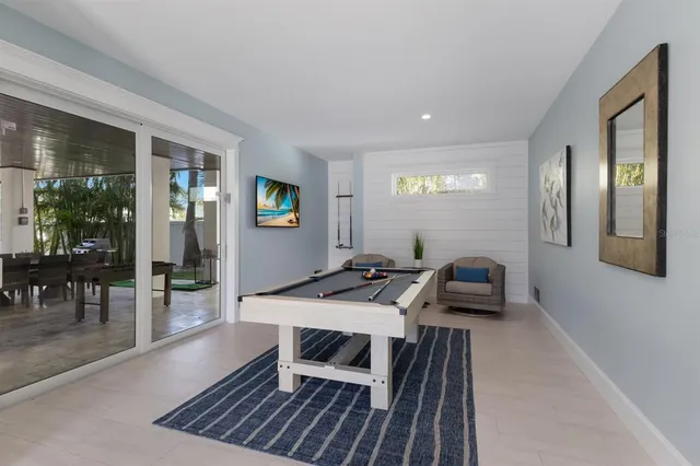 a view of staircase with wooden floor and white walls