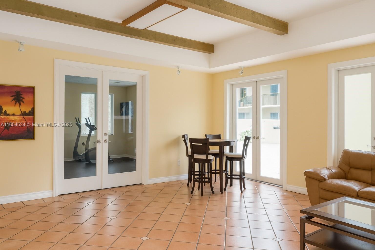 8650 Southwest 67th Avenue, Unit 1032 Pinecrest, FL 33156 - Photo 14 of 16 a view of a livingroom with furniture and a potted plant