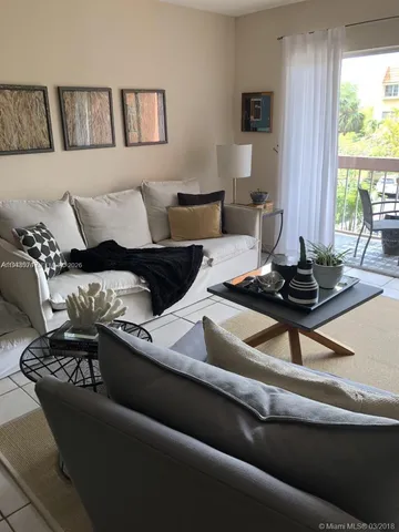 a living room with furniture or couch and a window