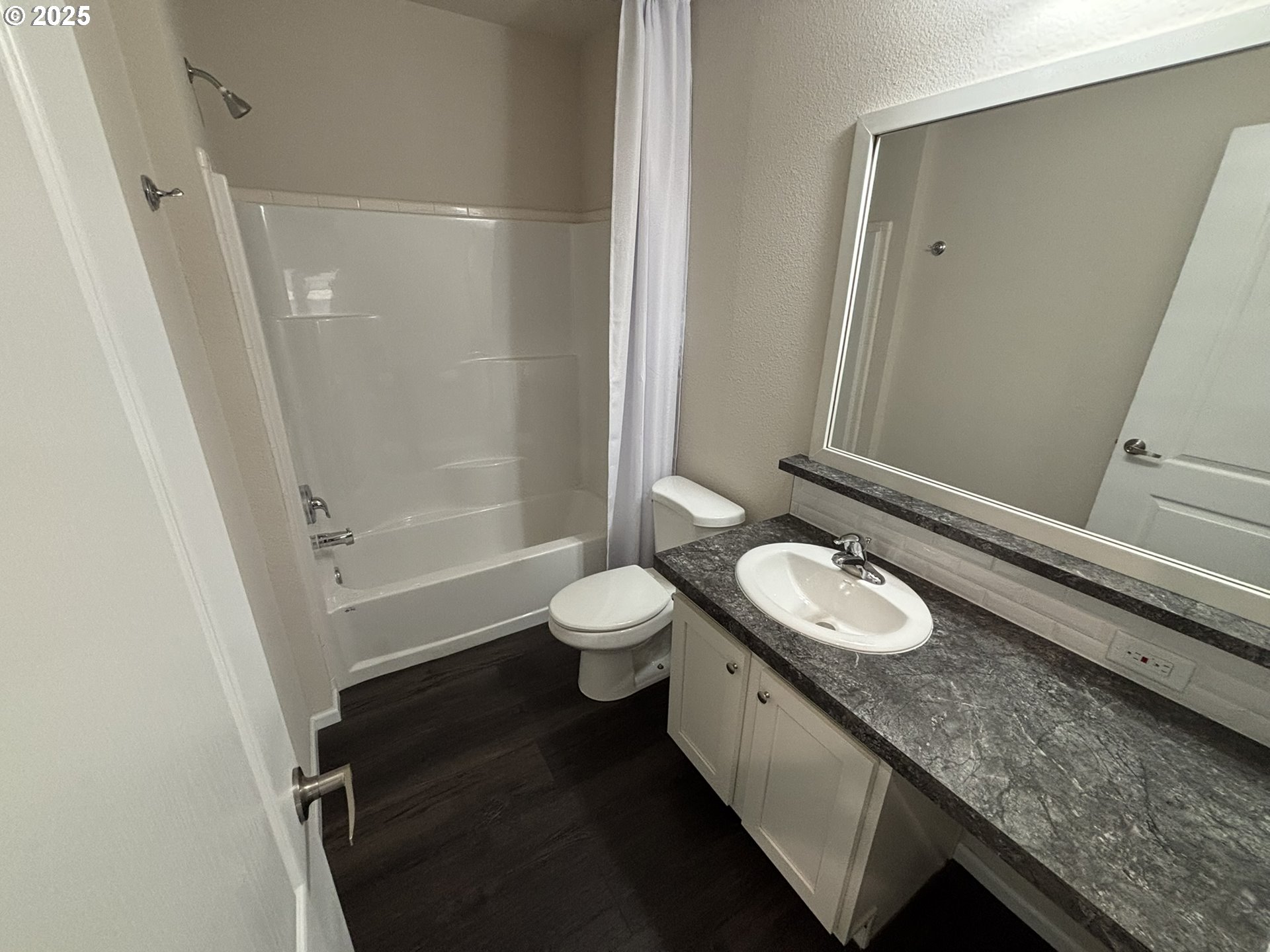 5270 Nopal Street Florence, OR 97439 - Photo 16 of 27 a bathroom with a granite countertop sink a toilet a mirror and shower