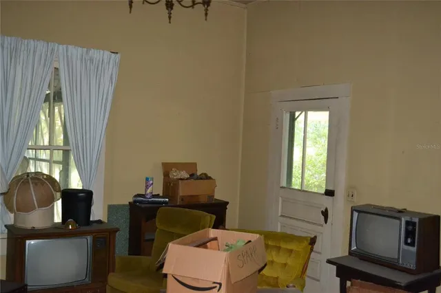 a view of a balcony with a table and chairs