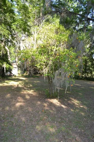 a view of a barn in the middle of a yard