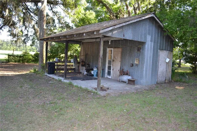 a view of a yard with trees