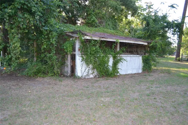 a view of a swimming pool and an outdoor space