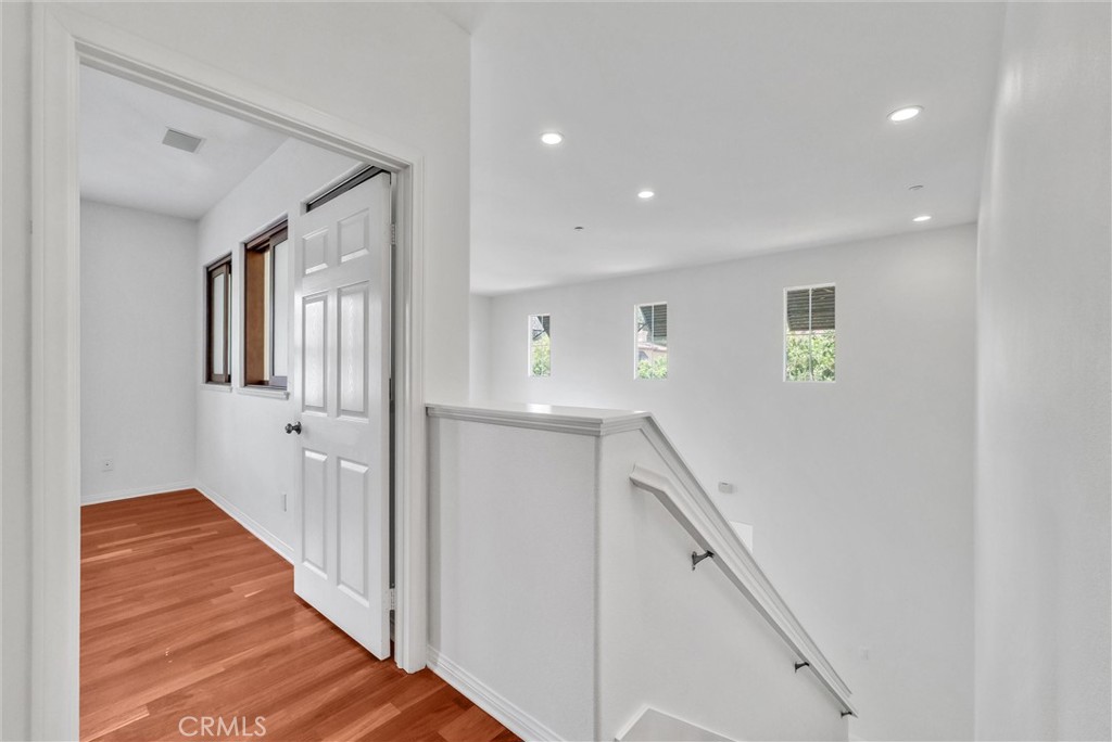 130 Roadrunner Irvine, CA 92603 - Photo 24 of 36 a view of a hallway with windows