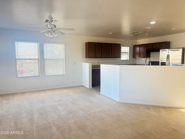 en empty room with fireplace and flat screen tv