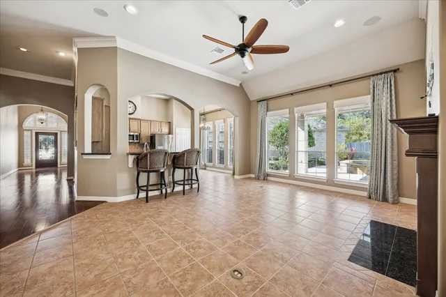 a view of a livingroom with furniture ceiling fan and window