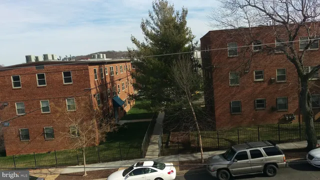 a view of a car parked in front of a building